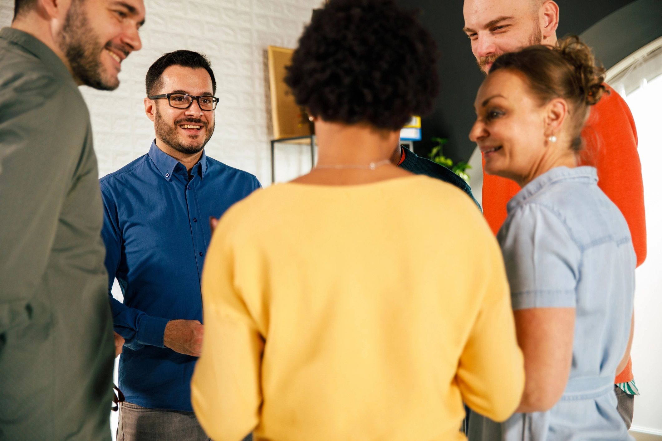 Attendees networking in a circle during an event