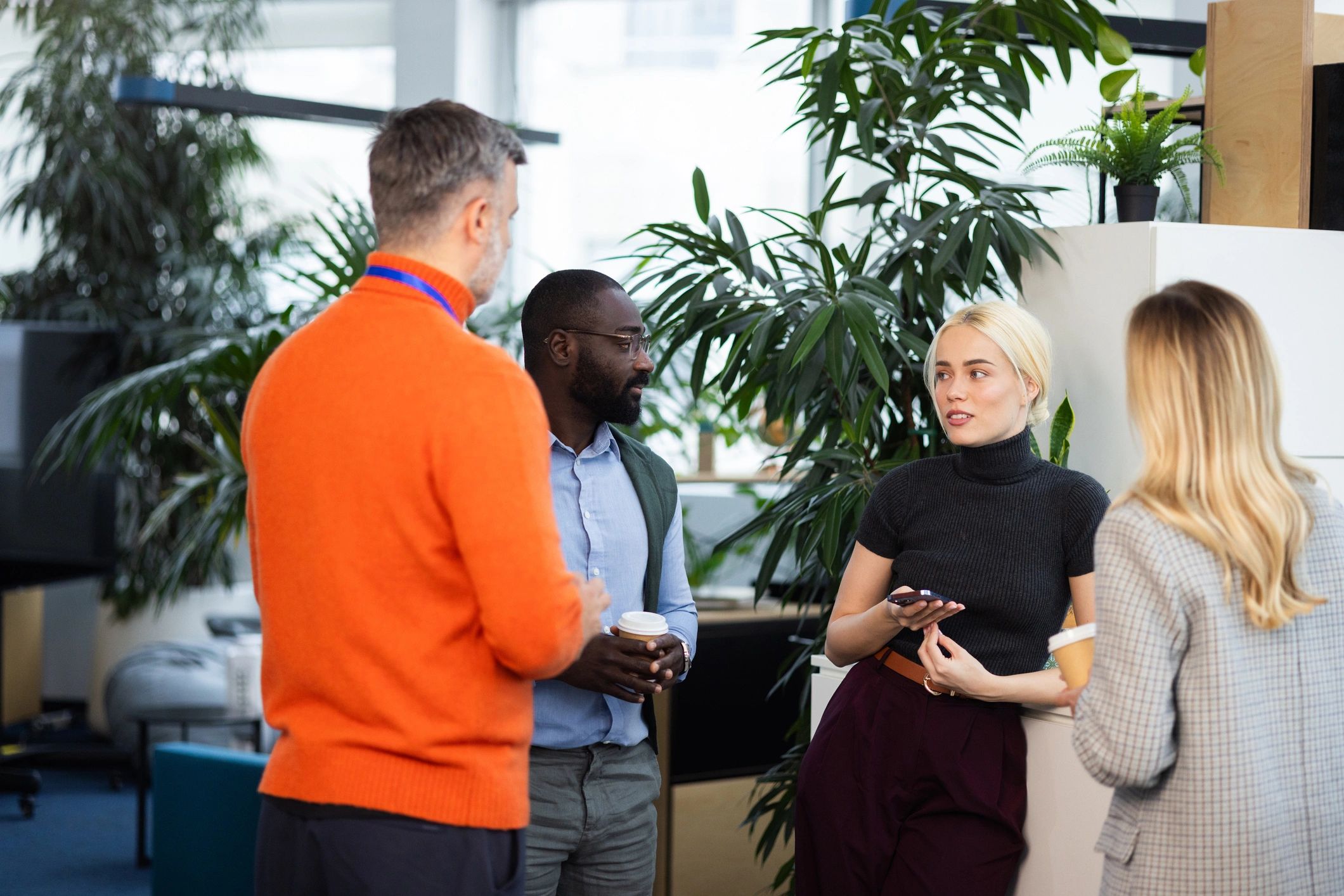 Professionals networking during a coffee break