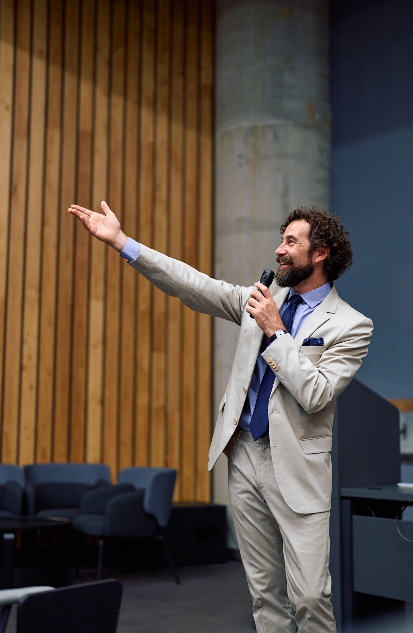 Conference speaker engaging an audience with a microphone