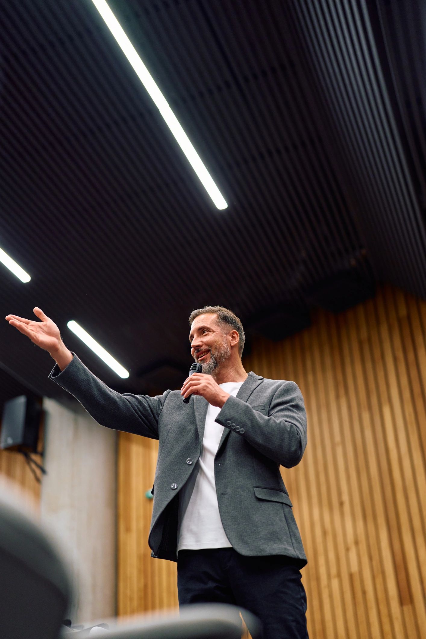 Professional speaker delivering an inspiring talk on stage